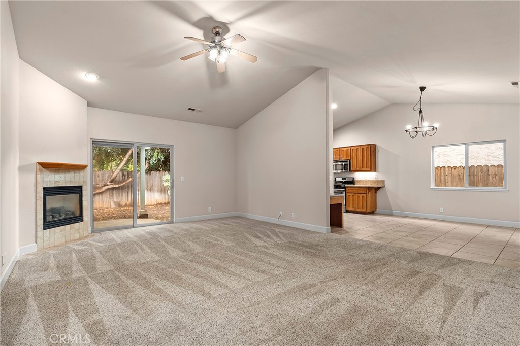3 Sunflower Court Chico, CA 95926 - Photo 7 of 40 a view of an empty room with a fireplace and a window