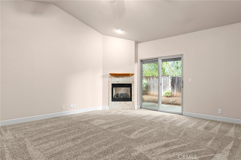 3 Sunflower Court Chico, CA 95926 - Photo 8 of 40 a view of an empty room with a window and fireplace