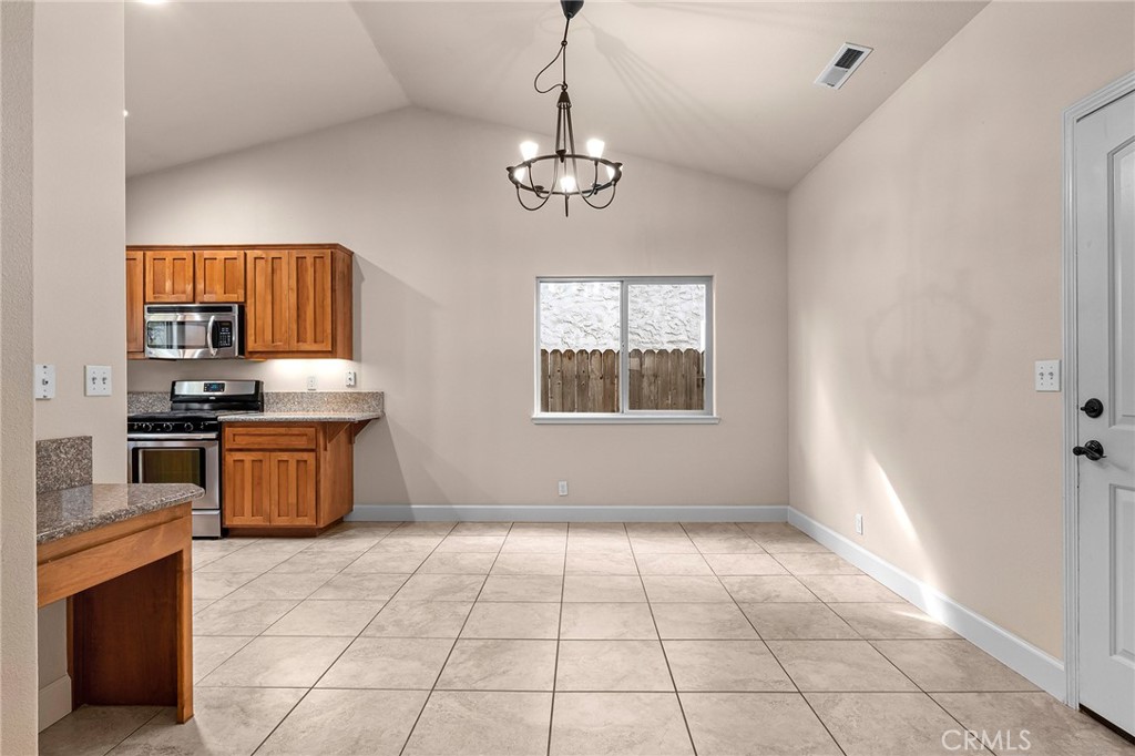 3 Sunflower Court Chico, CA 95926 - Photo 10 of 40 a kitchen with stainless steel appliances granite countertop a stove a sink and a refrigerator