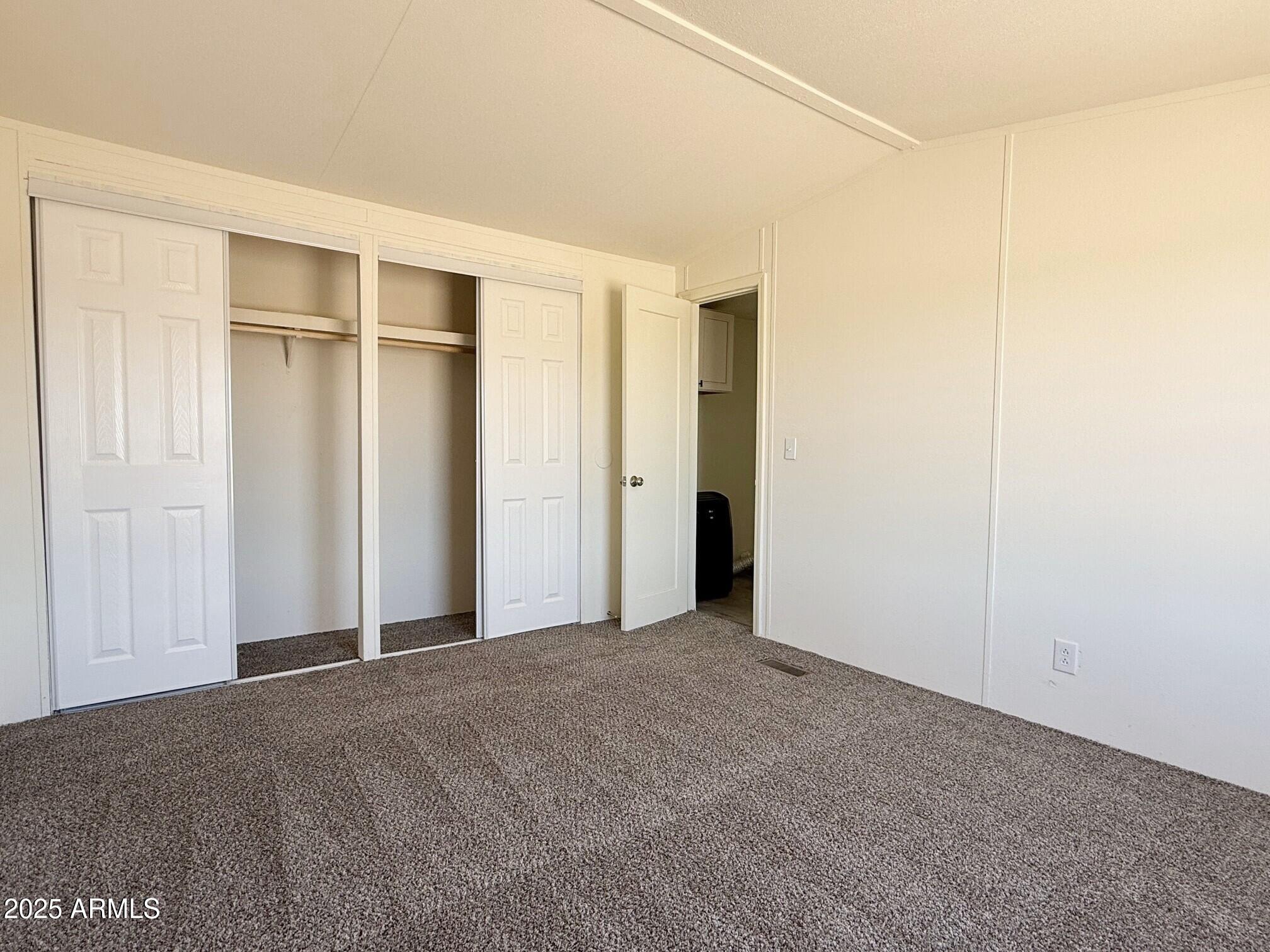 373 South Amarillo Valley Road Maricopa, AZ 85139 - Photo 16 of 23 a view of an empty room