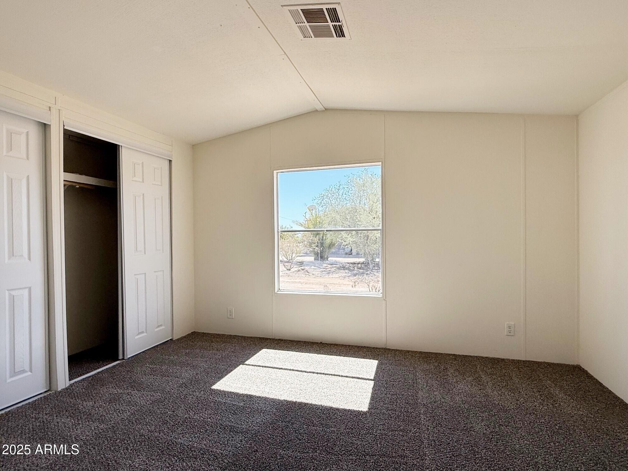 373 South Amarillo Valley Road Maricopa, AZ 85139 - Photo 18 of 23 an empty room with windows