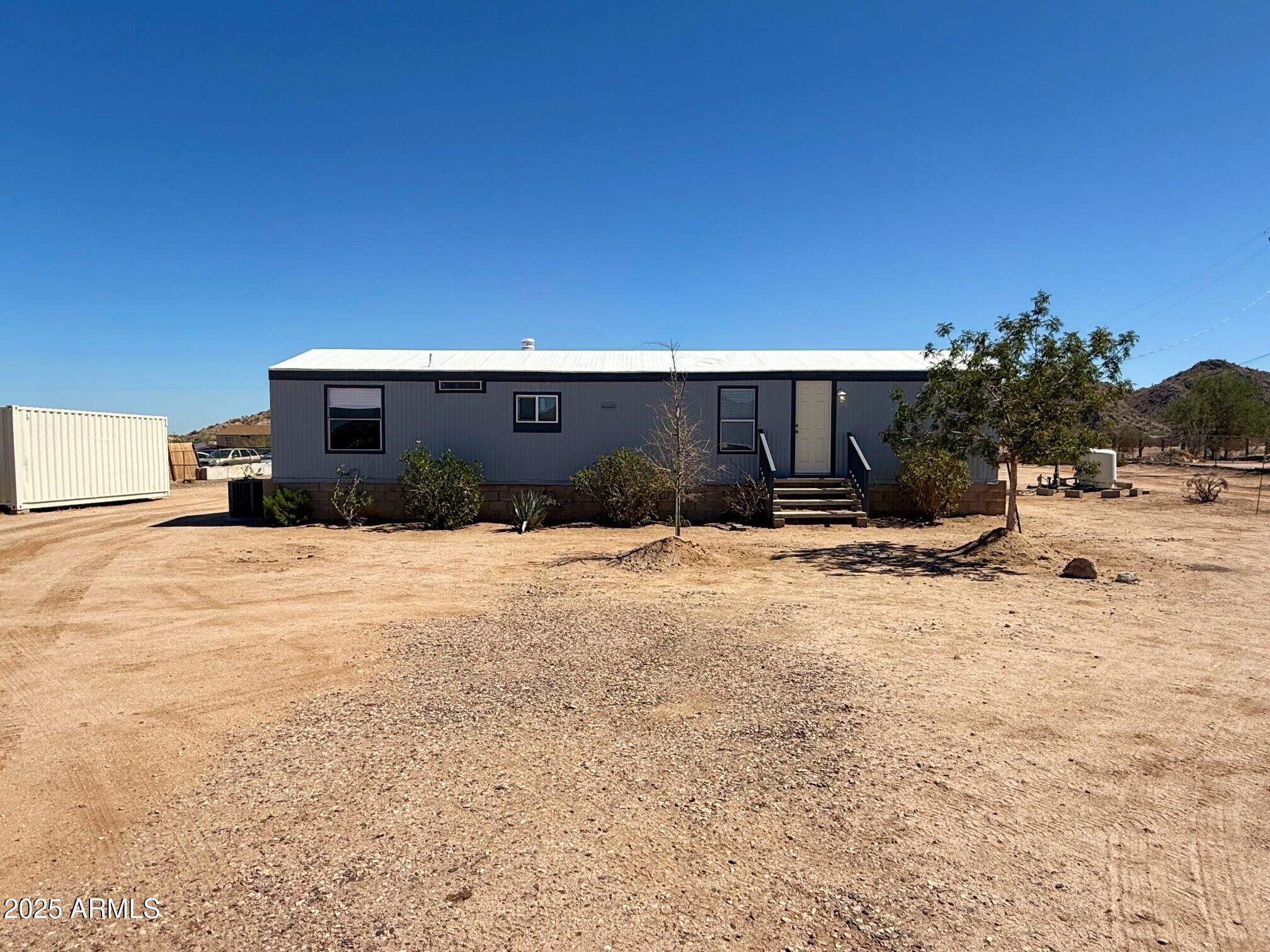 373 South Amarillo Valley Road Maricopa, AZ 85139 - Photo 5 of 23 a view of backyard of the house