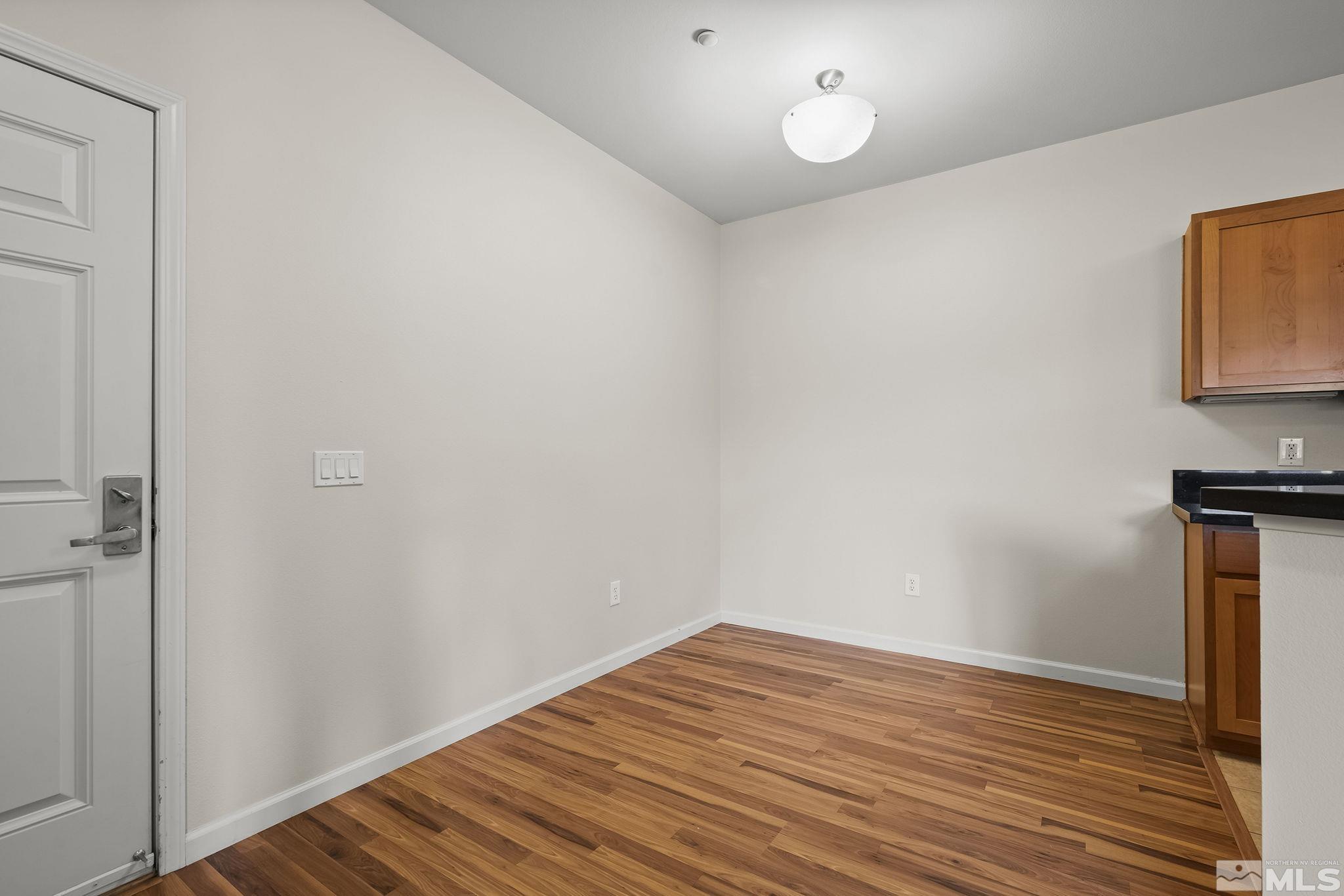 1450 Idlewild Drive, Unit 933 Reno, NV 89509 - Photo 13 of 32 a view of empty room with wooden floor