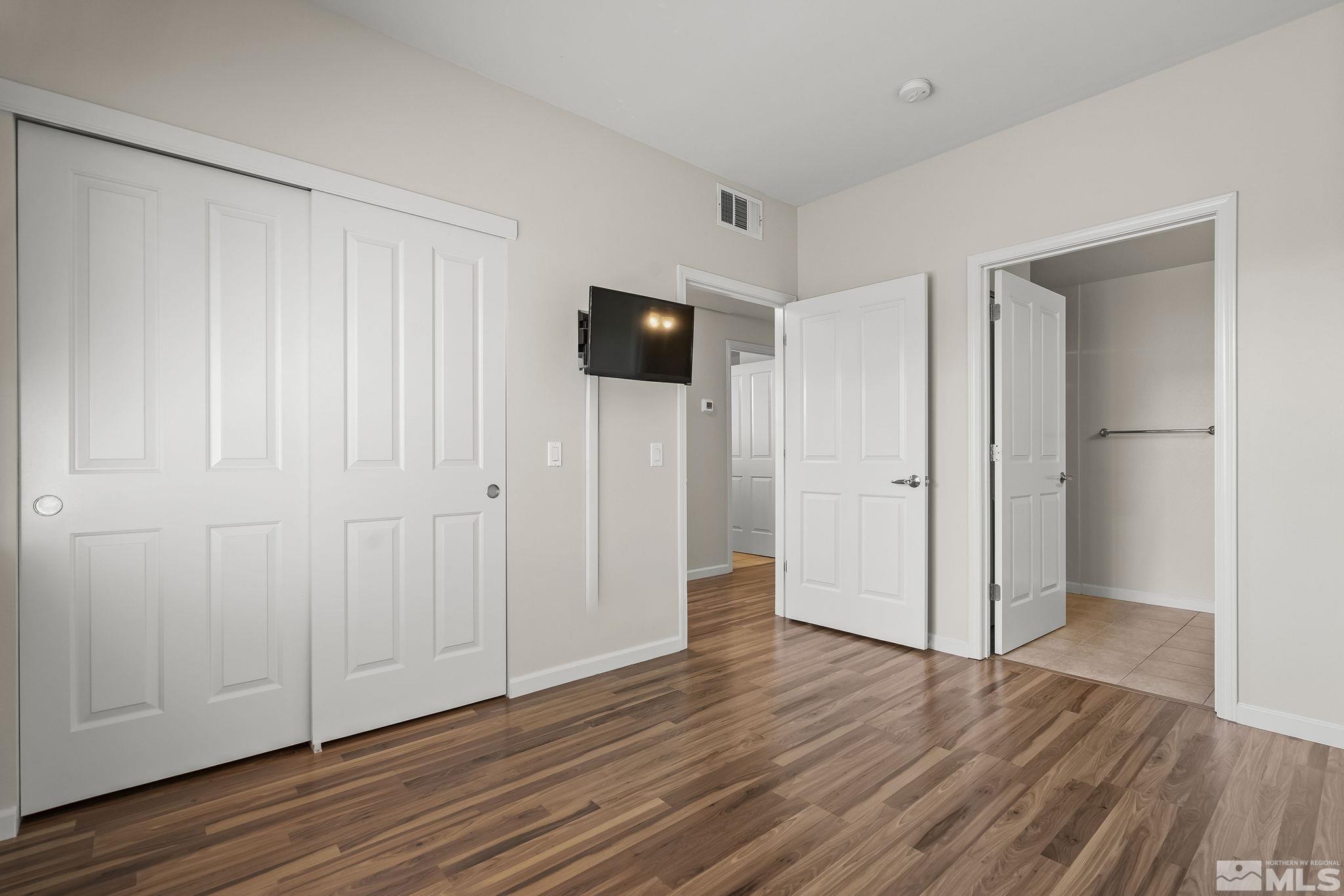 1450 Idlewild Drive, Unit 933 Reno, NV 89509 - Photo 15 of 32 a view of a livingroom with wooden floor