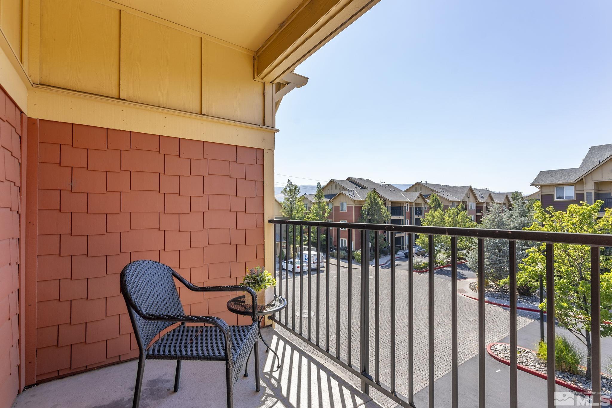 1450 Idlewild Drive, Unit 933 Reno, NV 89509 - Photo 21 of 32 a view of a chair and table in the balcony