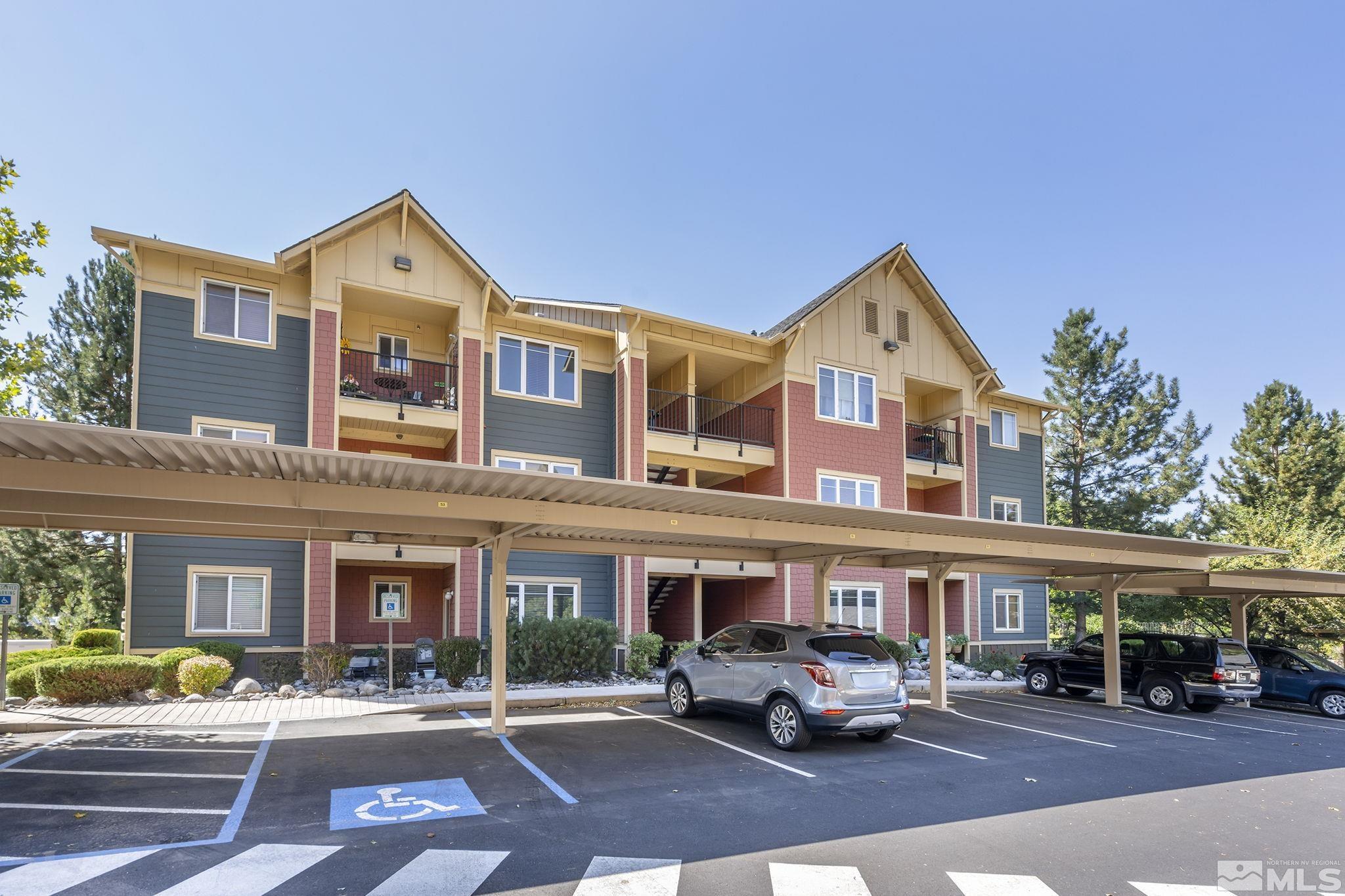 1450 Idlewild Drive, Unit 933 Reno, NV 89509 - Photo 23 of 32 a front view of a building with street cars parked