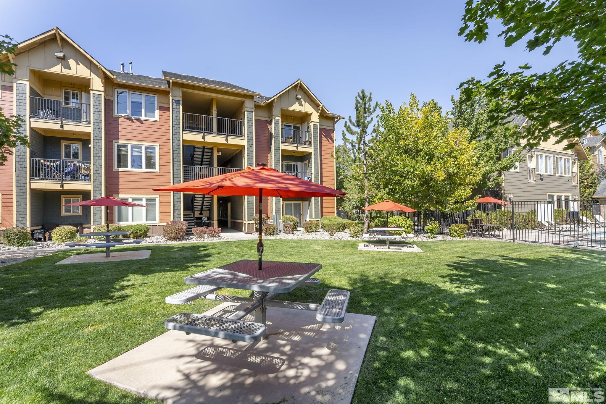 1450 Idlewild Drive, Unit 933 Reno, NV 89509 - Photo 27 of 32 a front view of a house with a yard