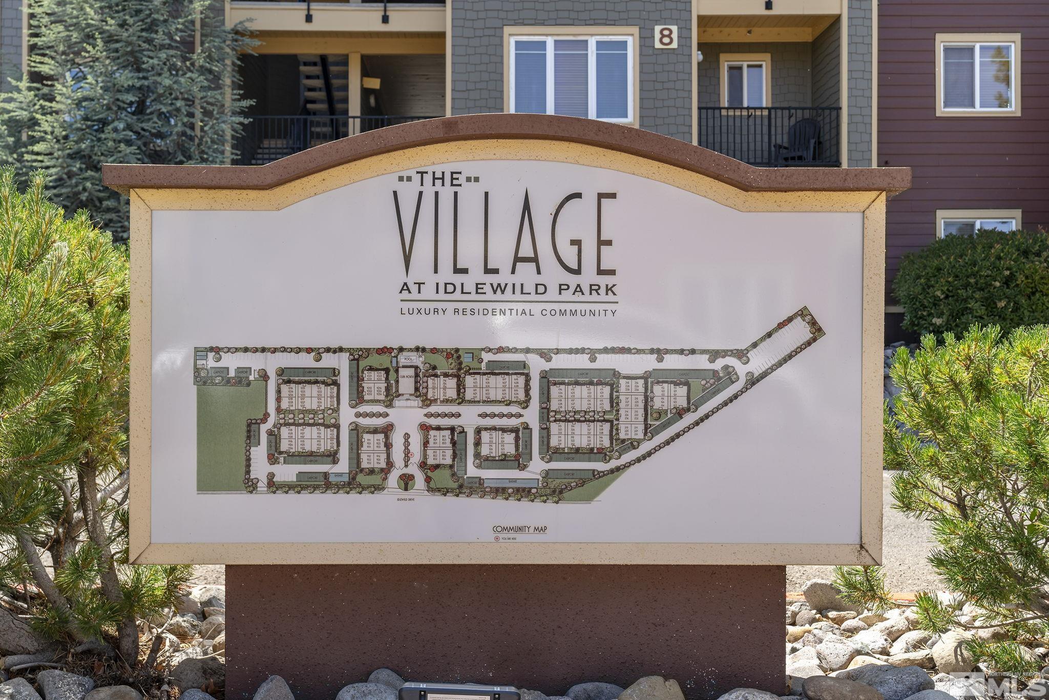 1450 Idlewild Drive, Unit 933 Reno, NV 89509 - Photo 29 of 32 a view of a house with a window and potted plants