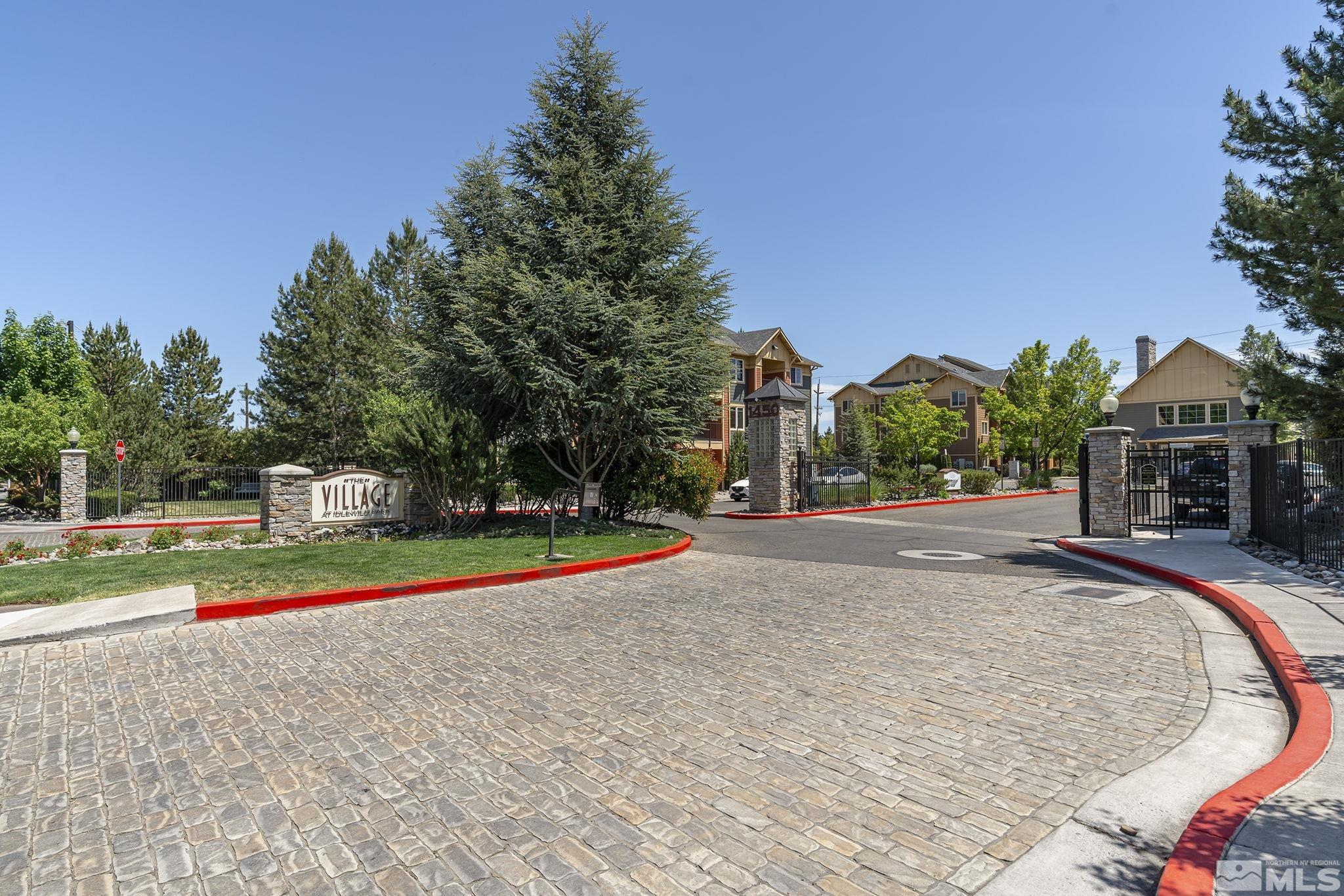 1450 Idlewild Drive, Unit 933 Reno, NV 89509 - Photo 30 of 32 a view of street with tall buildings and a big yard