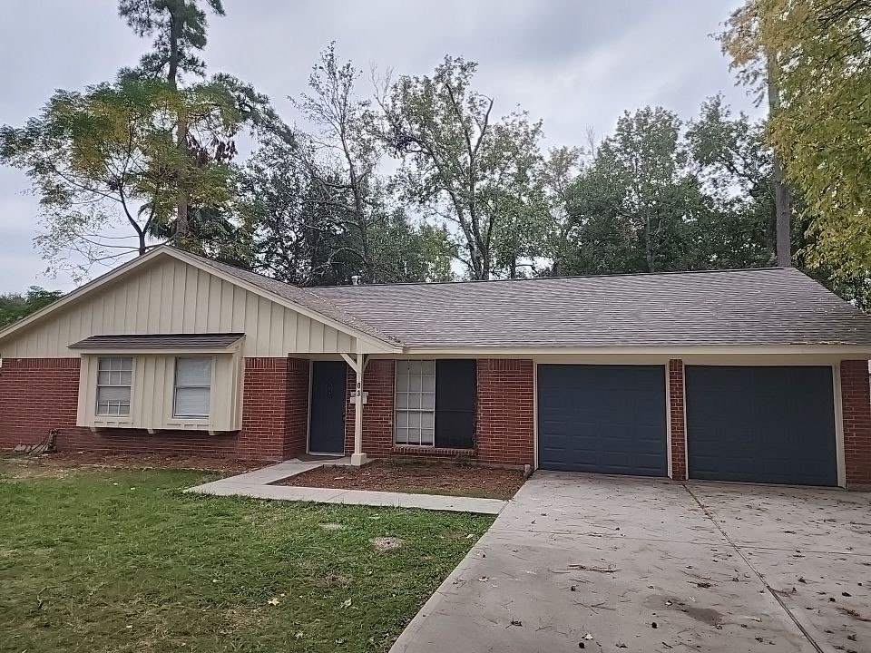 2903 Crossfell Road Spring, TX 77388 - Photo 1 of 13 a front view of a house with a garden and trees
