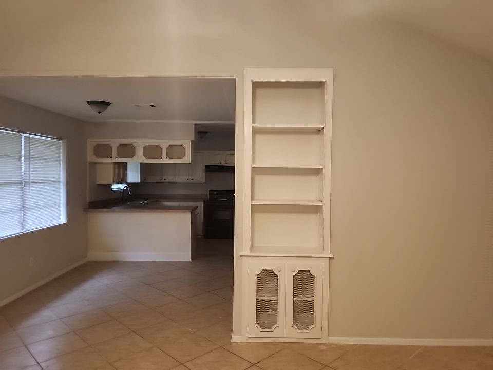 2903 Crossfell Road Spring, TX 77388 - Photo 2 of 13 a kitchen with cabinets and window