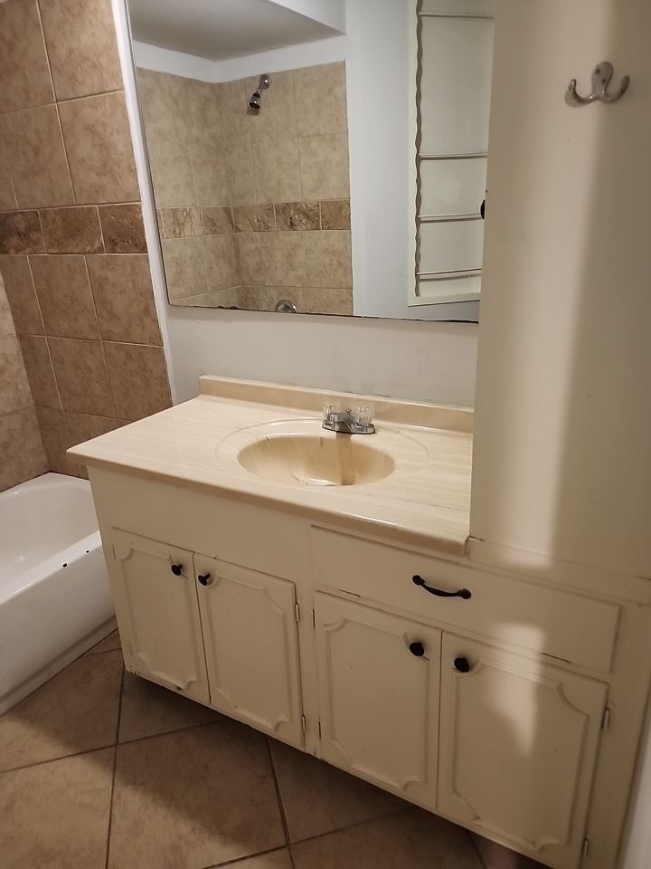 2903 Crossfell Road Spring, TX 77388 - Photo 10 of 13 a bathroom with a sink and a mirror