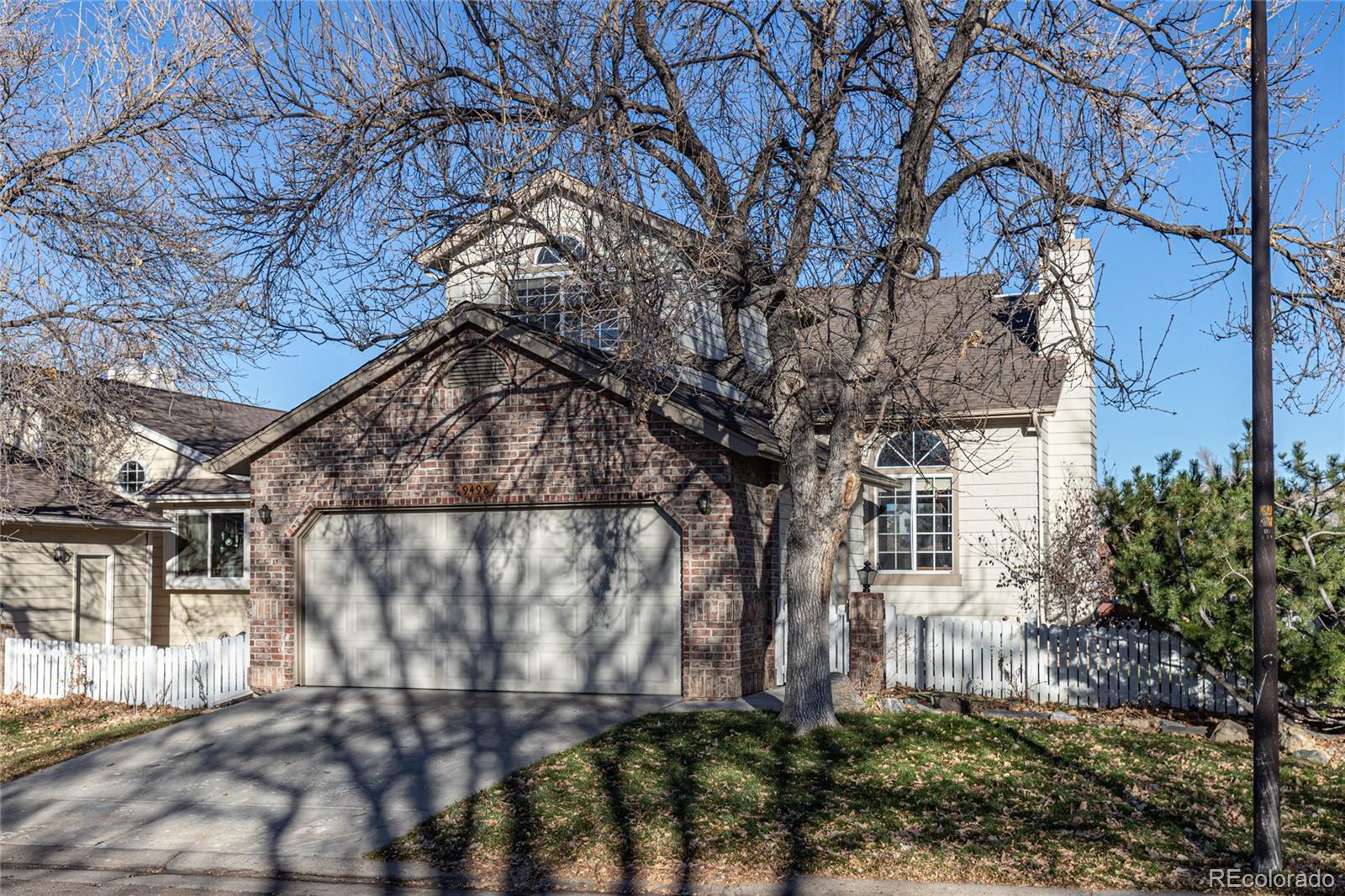 9498 Pendleton Drive Highlands Ranch, CO 80126 - Photo 1 of 28 a view of a house with a tree