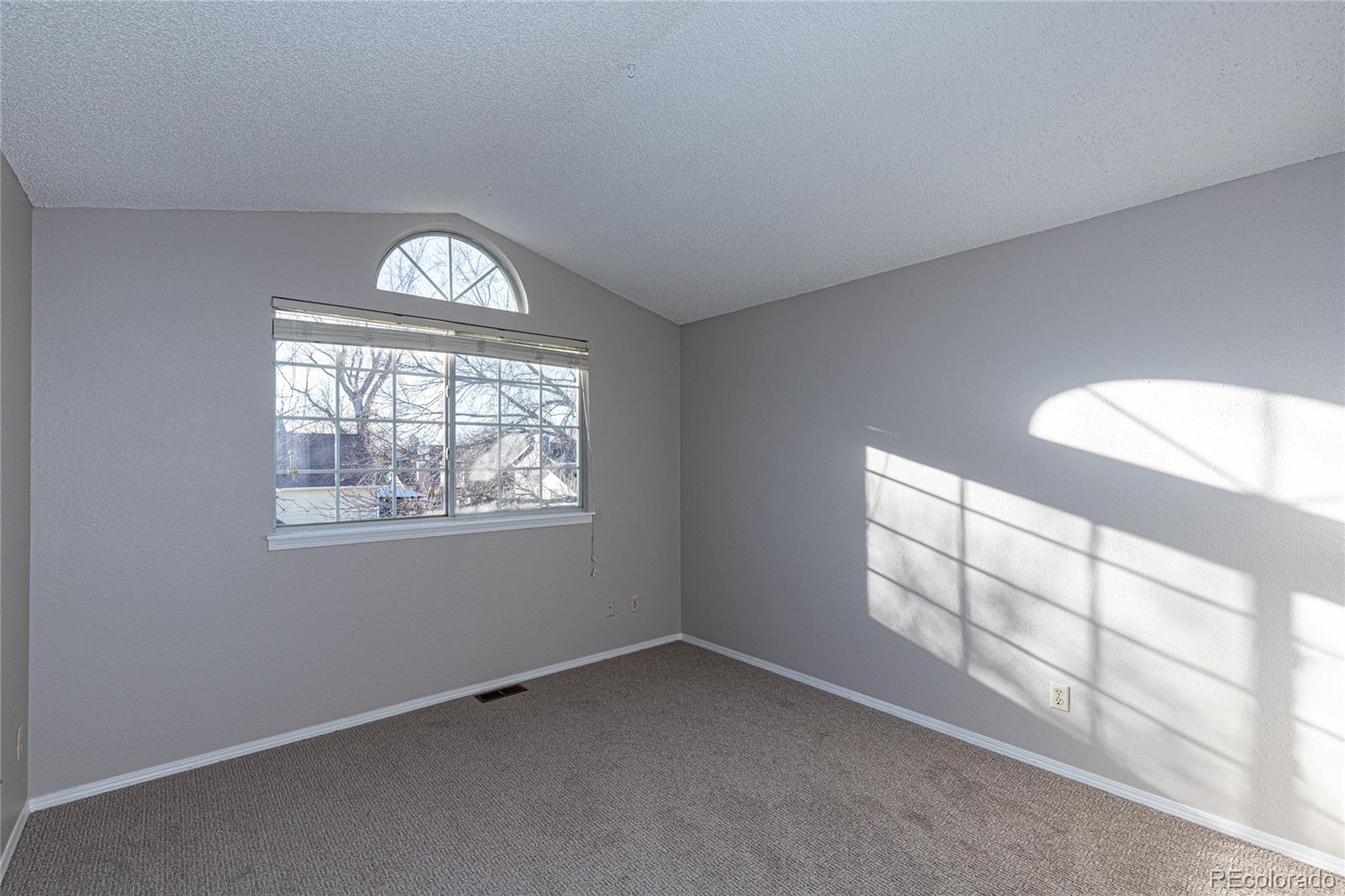 9498 Pendleton Drive Highlands Ranch, CO 80126 - Photo 18 of 28 an empty room with windows