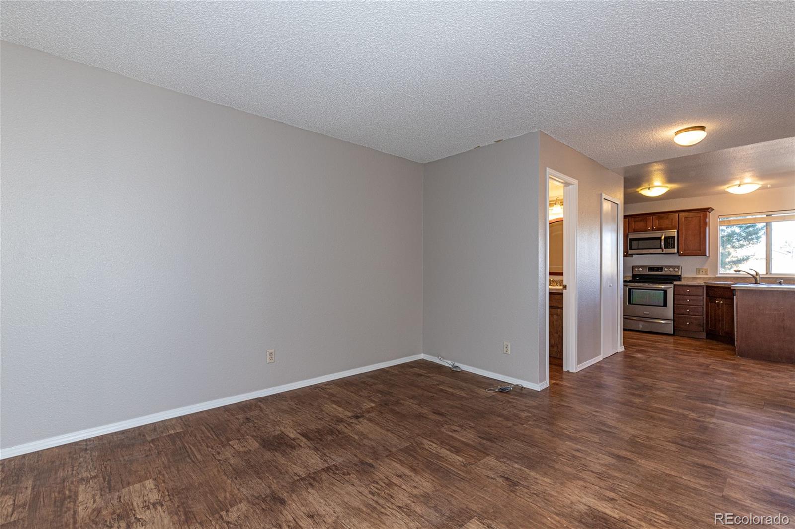 9498 Pendleton Drive Highlands Ranch, CO 80126 - Photo 10 of 28 a view of a kitchen with a sink and a refrigerator