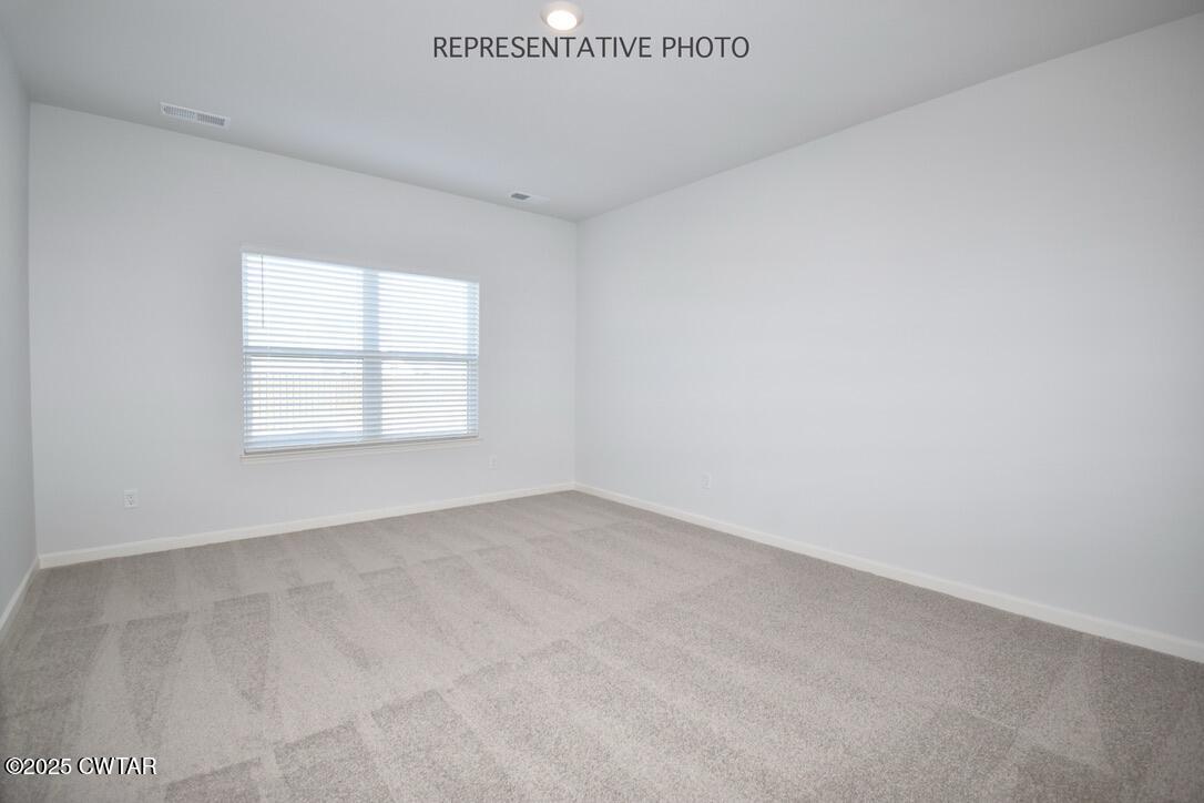 39 Kings Gate Cove Jackson, TN 38305 - Photo 8 of 19 an empty room with a window
