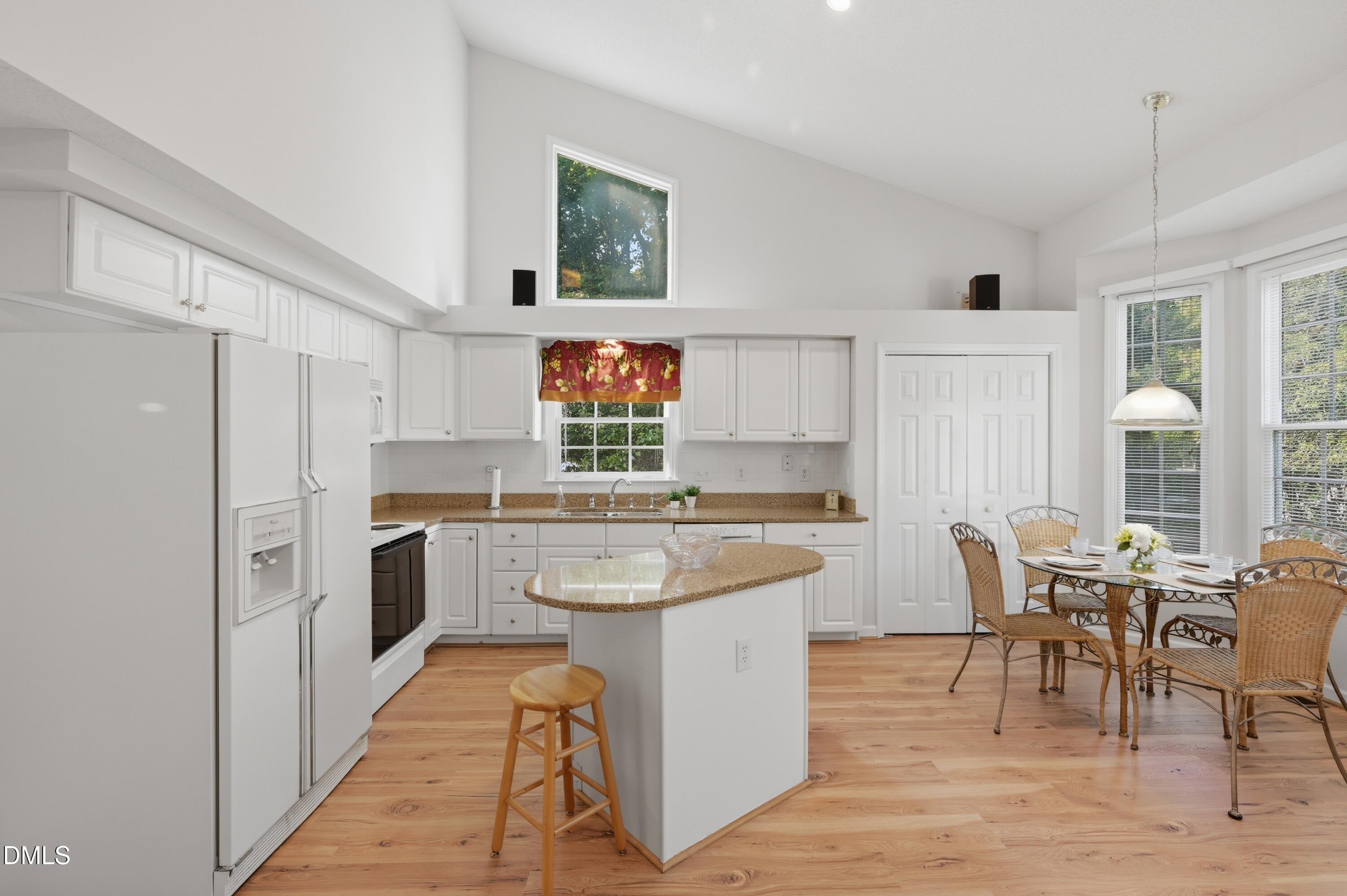 6801 Lynnoak Drive Raleigh, NC 27613 - Photo 11 of 30 a kitchen with a sink a counter top space and stainless steel appliances