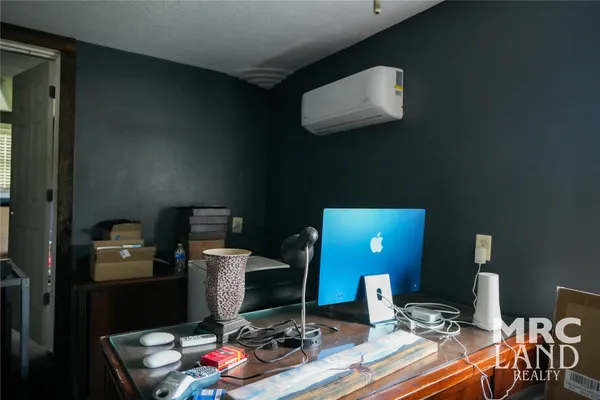 a view of a workspace with furniture