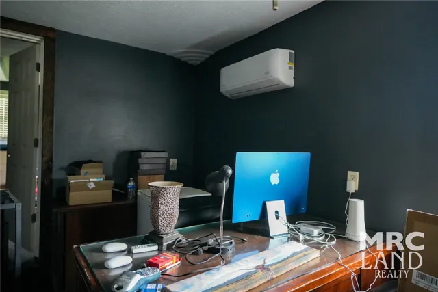 a view of a workspace with furniture