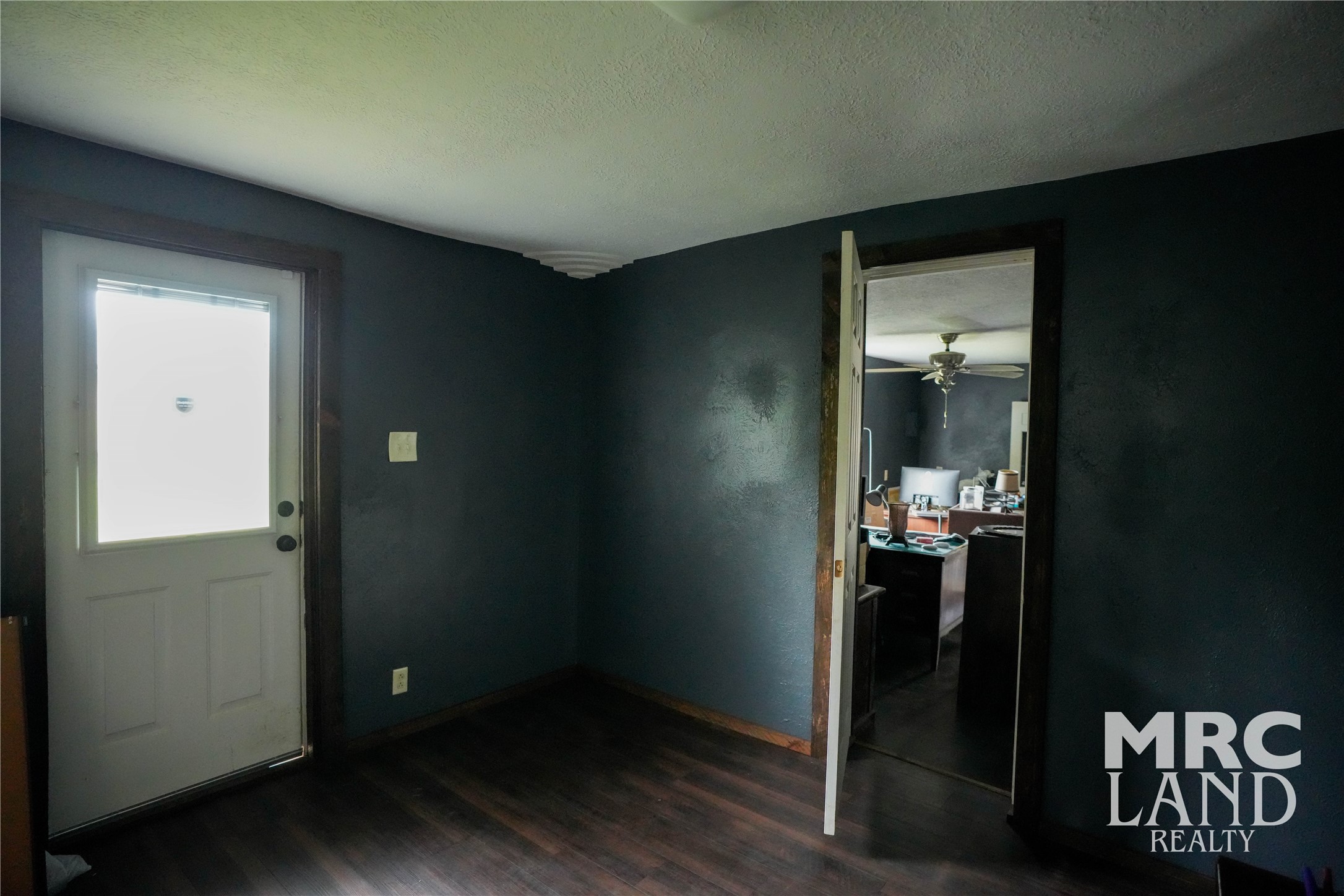 102 South Wheeler Avenue Colmesneil, TX 75938 - Photo 13 of 17 an empty room with wooden floor and closet