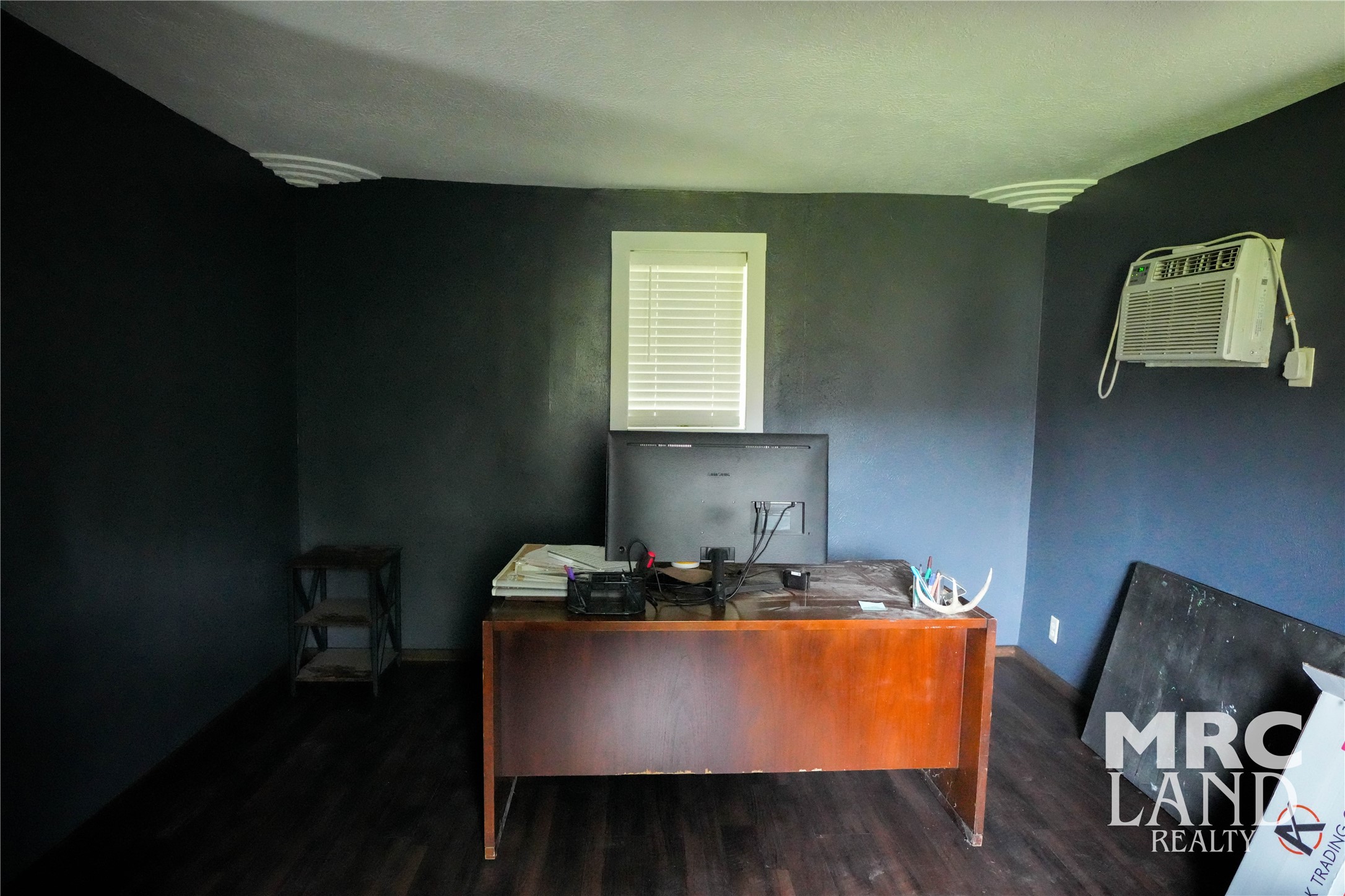 102 South Wheeler Avenue Colmesneil, TX 75938 - Photo 15 of 17 a dining room with table chairs and wooden floor