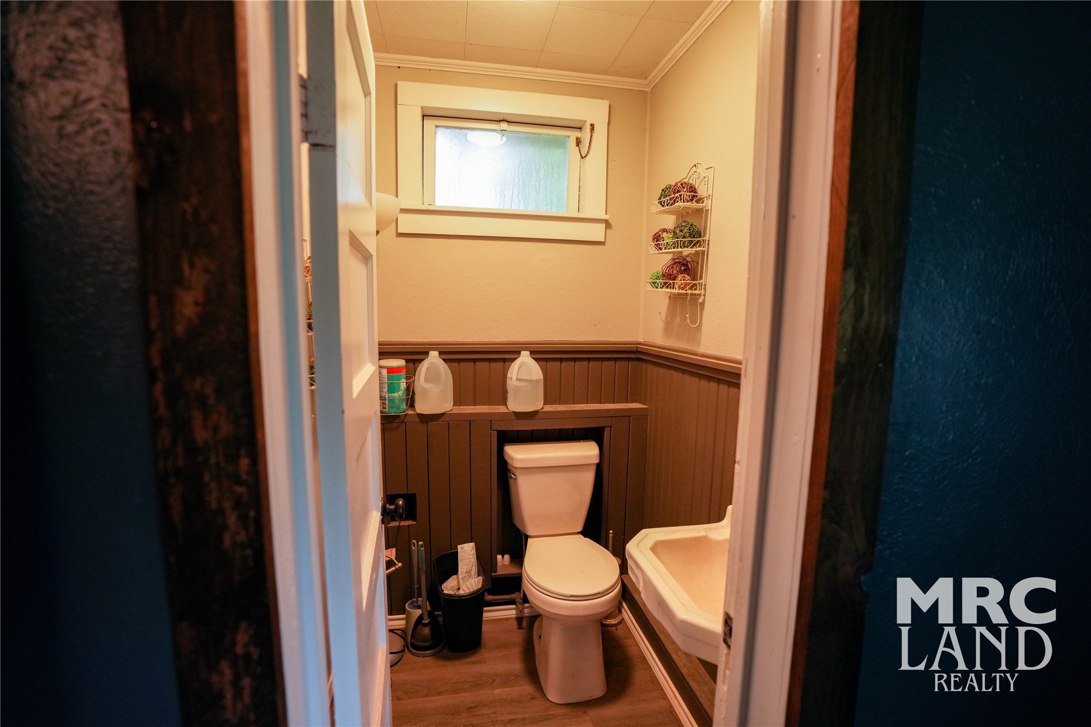 102 South Wheeler Avenue Colmesneil, TX 75938 - Photo 16 of 17 a white toilet sitting next to a bathroom sink