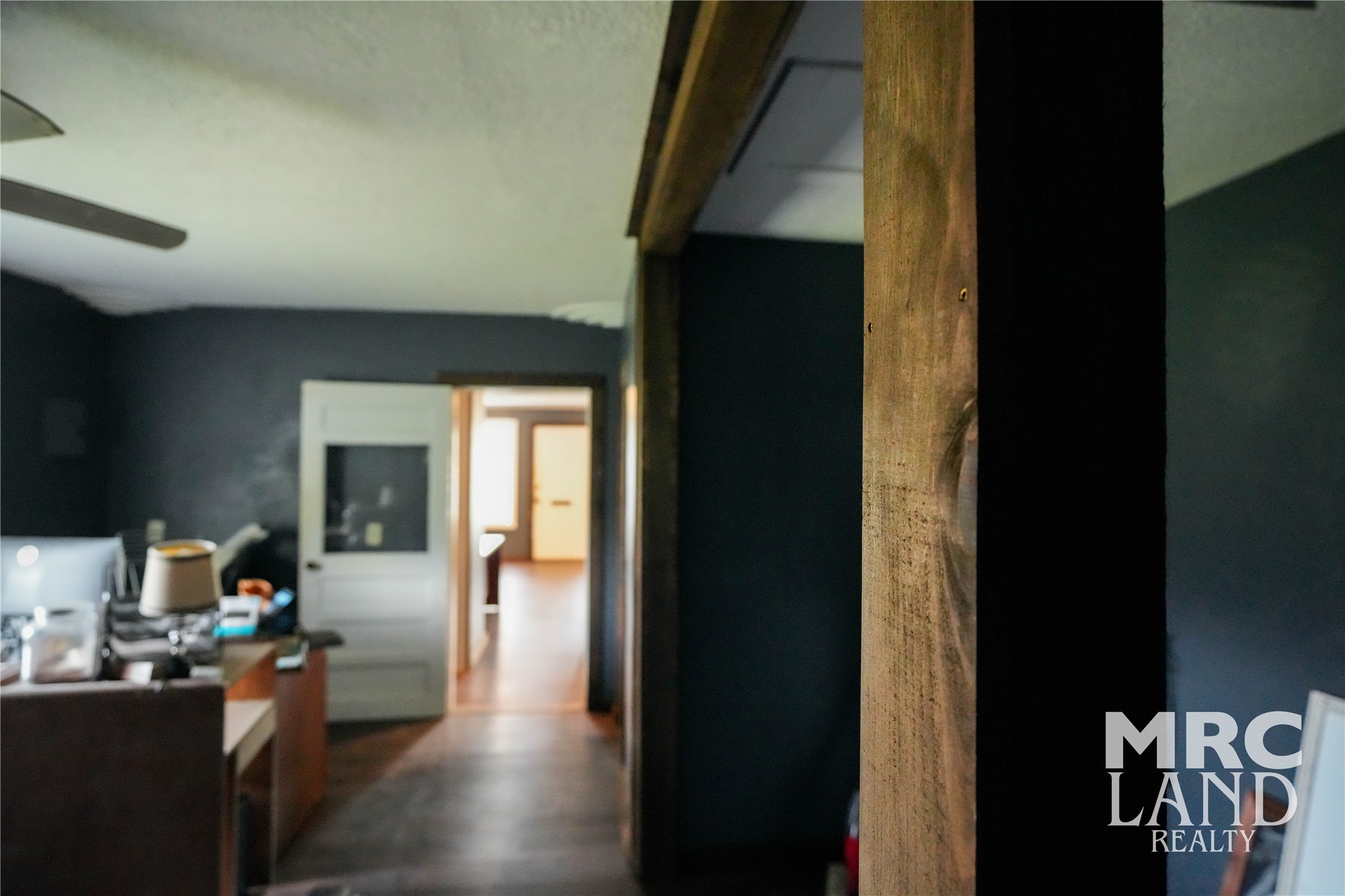 102 South Wheeler Avenue Colmesneil, TX 75938 - Photo 8 of 17 a hallway with a dining table and chairs in it