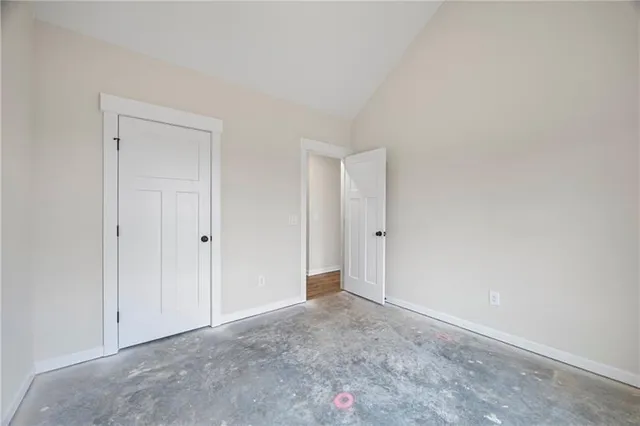 a view of an empty room and closet