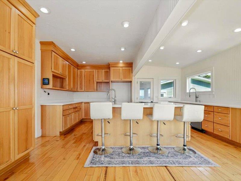 183 Lighthouse Way Crescent City, CA 95531 - Photo 22 of 87 a living room with couches chairs and kitchen view with wooden floor
