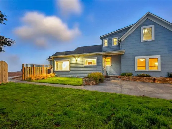 an aerial view of a houses with outdoor space