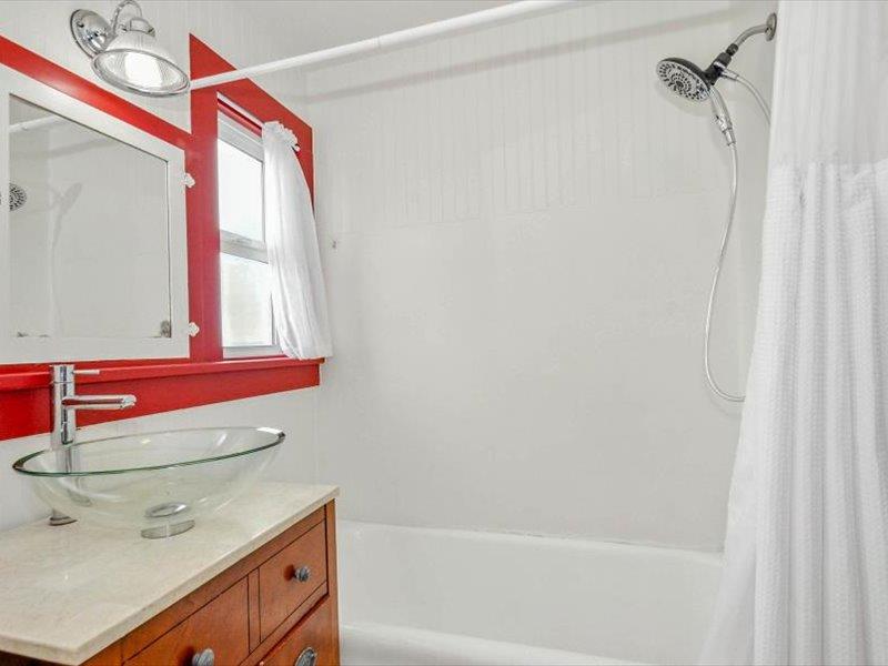 183 Lighthouse Way Crescent City, CA 95531 - Photo 57 of 87 a bathroom with a bath tub and a shower curtain