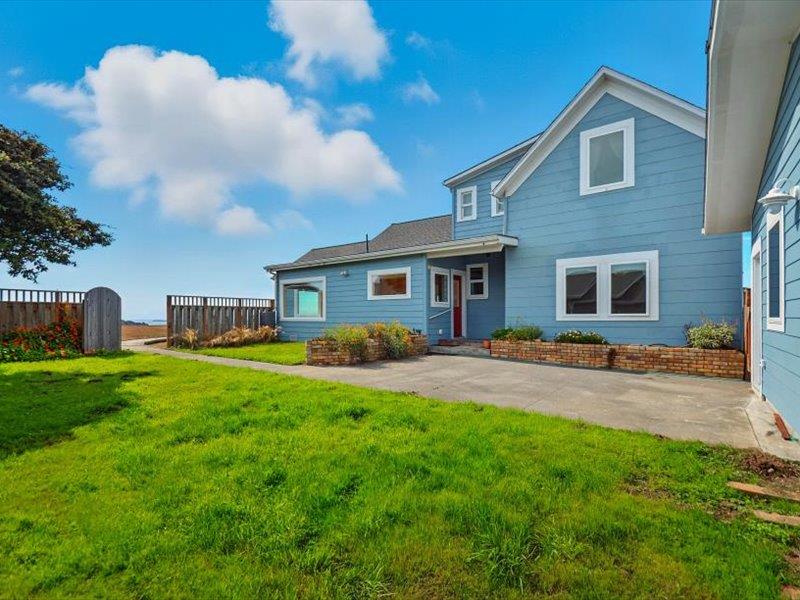 183 Lighthouse Way Crescent City, CA 95531 - Photo 66 of 87 a front view of a house with a yard and garage