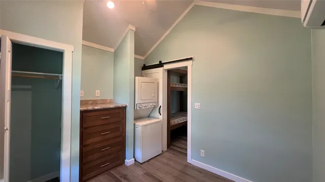 a room with closet and wooden floor
