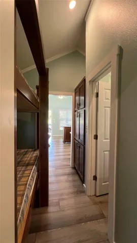 a view of a hallway view with wooden floor and staircase