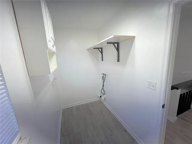 a view of small space with racks on the wall