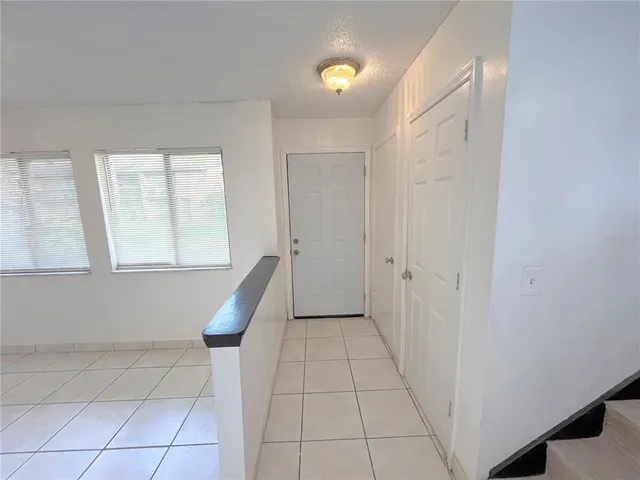 a view of a hallway with windows