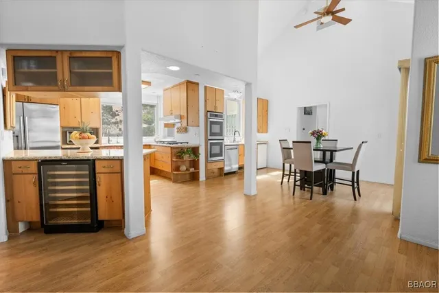 a view of a work space with furniture and wooden floor