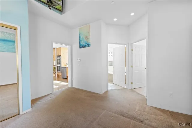 an empty room with windows and entrance