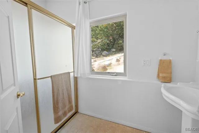 a bathroom with a sink and a window