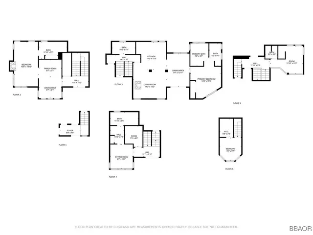 a white wall with painting on it