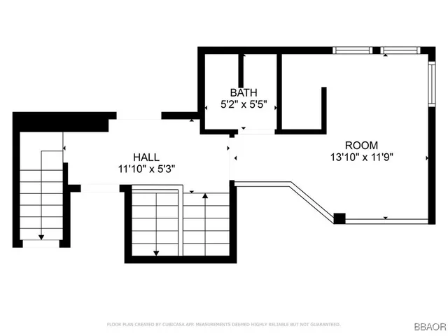 a picture of a wall with a large window and a white wall