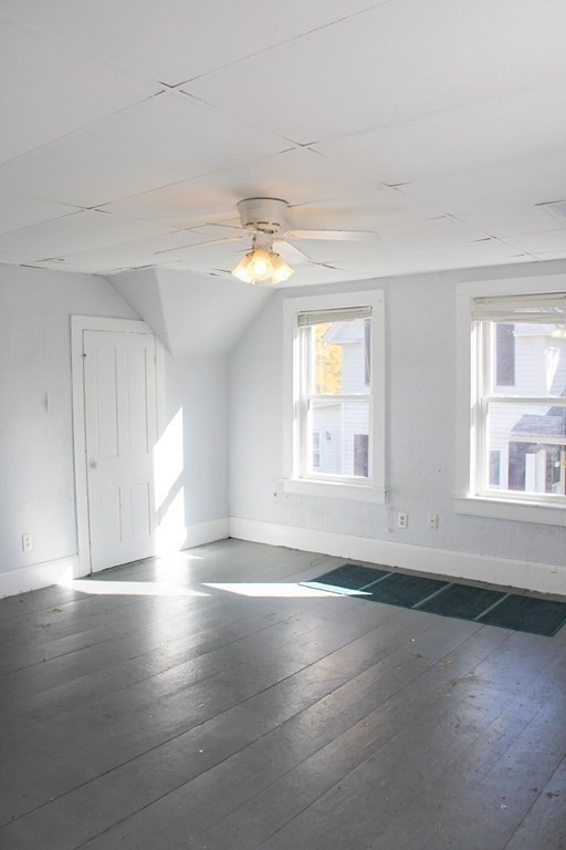 64 High Street Gardner, MA 01440 - Photo 13 of 20 an empty room with wooden floor and windows