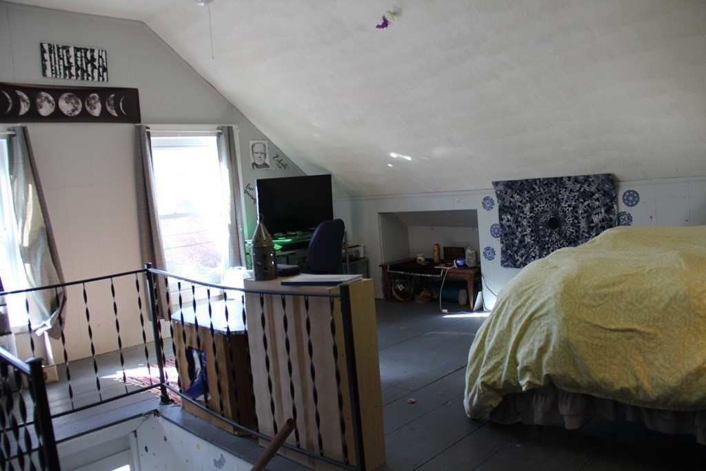 64 High Street Gardner, MA 01440 - Photo 19 of 20 a bedroom with furniture and a flat screen tv