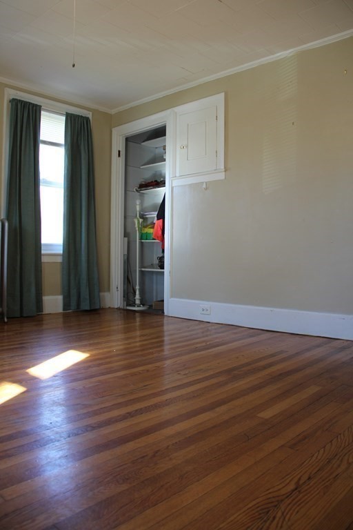 64 High Street Gardner, MA 01440 - Photo 6 of 20 an empty room with wooden floor and windows