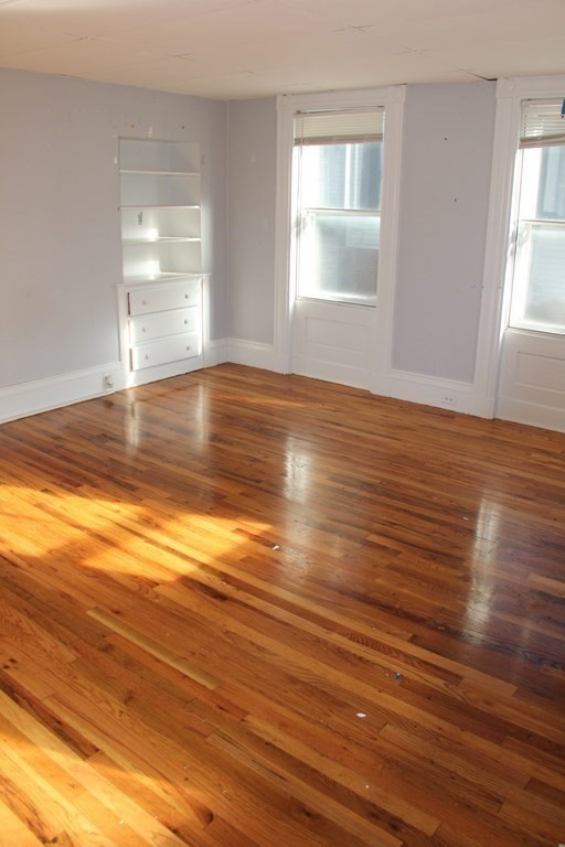 64 High Street Gardner, MA 01440 - Photo 7 of 20 a view of empty room with wooden floor and fan