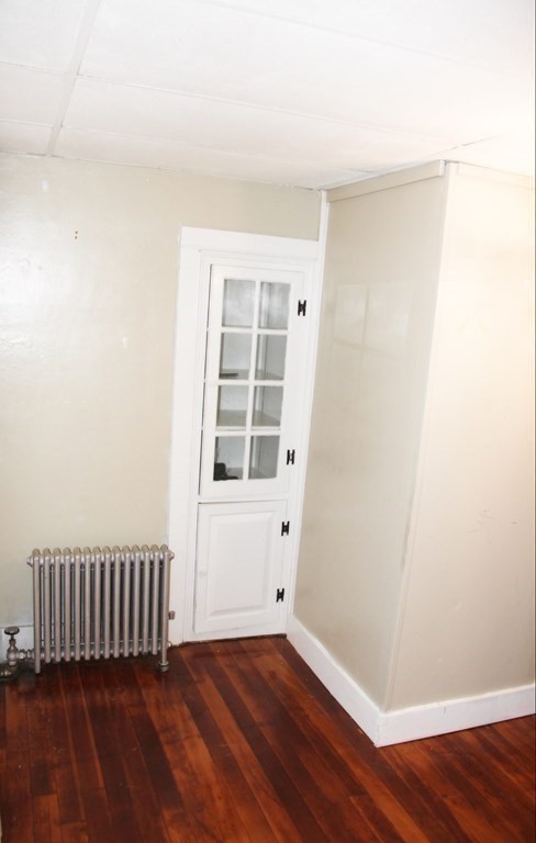 64 High Street Gardner, MA 01440 - Photo 9 of 20 an empty room with wooden floor and windows