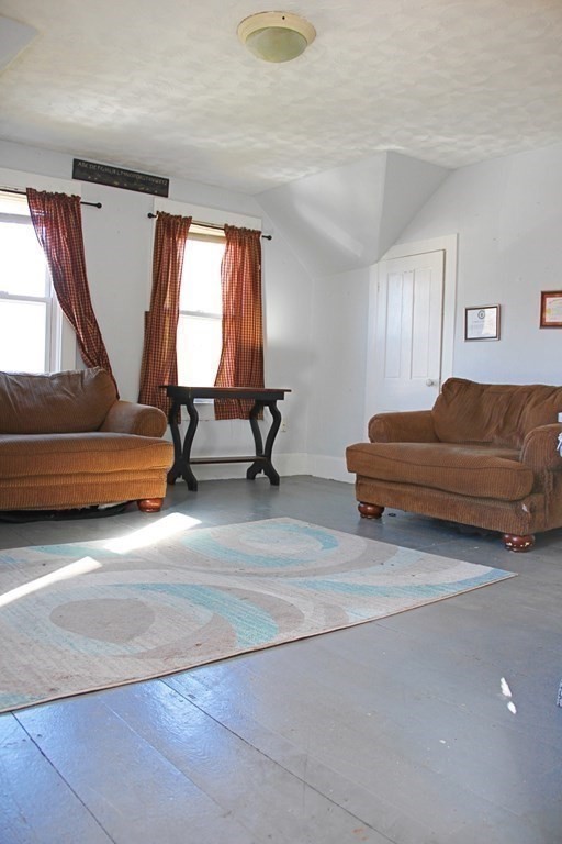 64 High Street Gardner, MA 01440 - Photo 10 of 20 a living room with a couch and a window