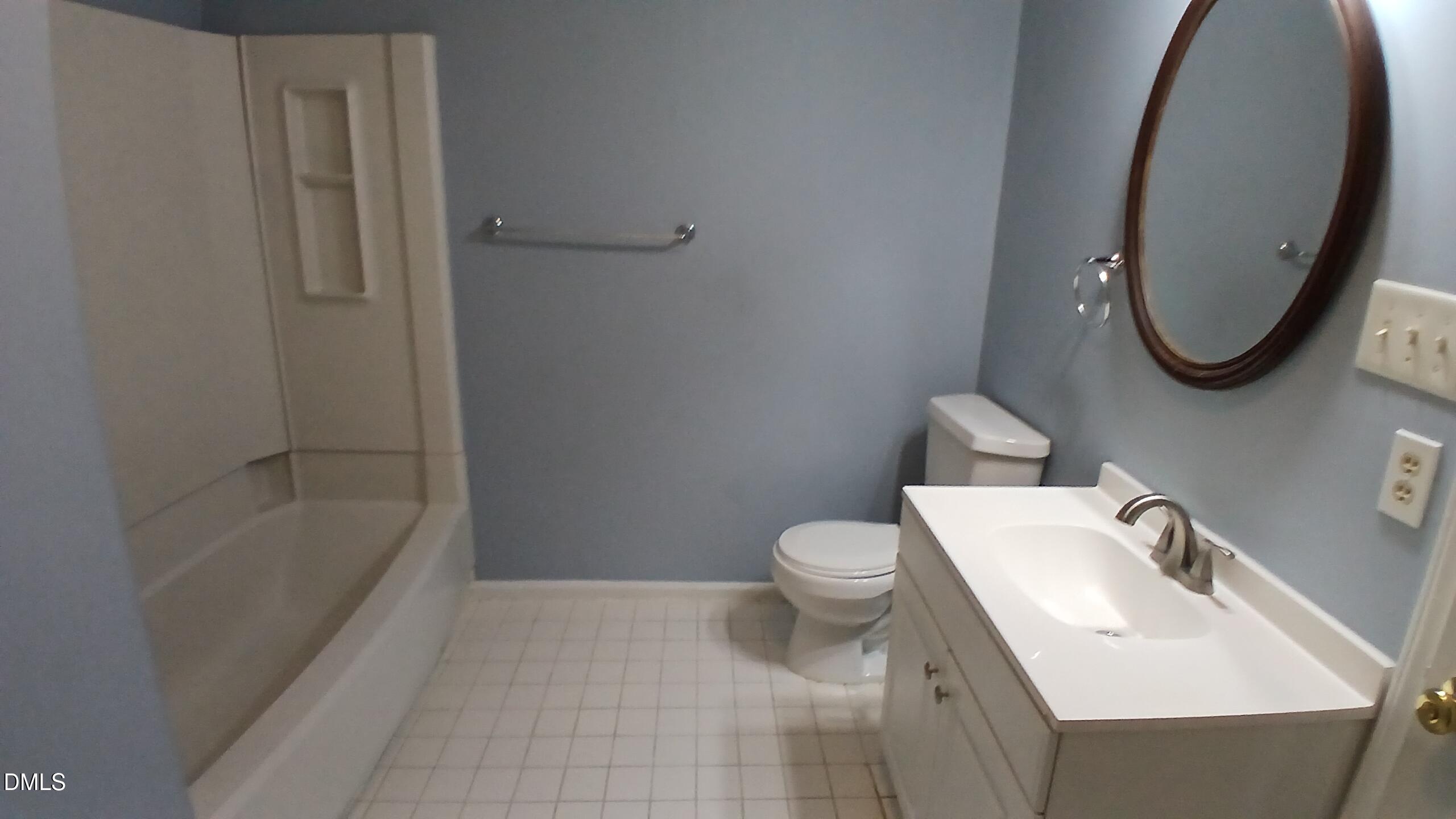 3504 East Jameson Road Raleigh, NC 27604 - Photo 21 of 35 a bathroom with a sink toilet and bathtub