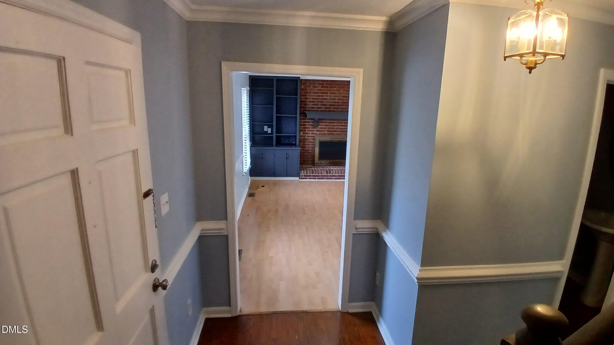 3504 East Jameson Road Raleigh, NC 27604 - Photo 4 of 35 a view of a hallway with wooden floor and staircase
