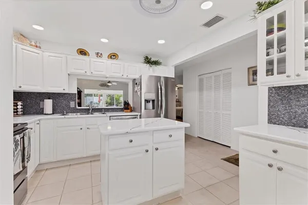 a kitchen with a refrigerator and window